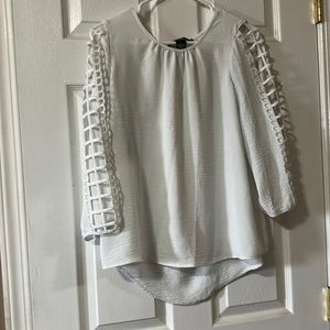 White flowy and breezy blouse with arm accents